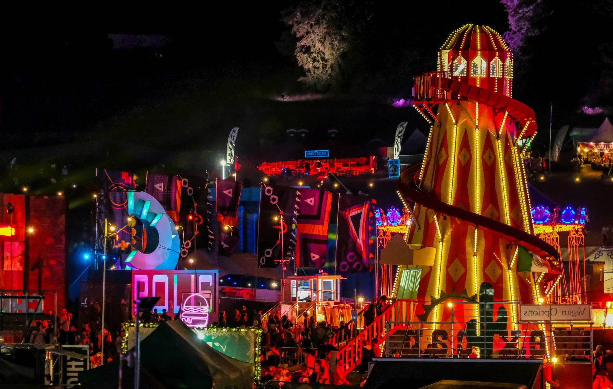 The sun rising over Boomtown Festival in 2023, capturing the vibrant energy of the event.
