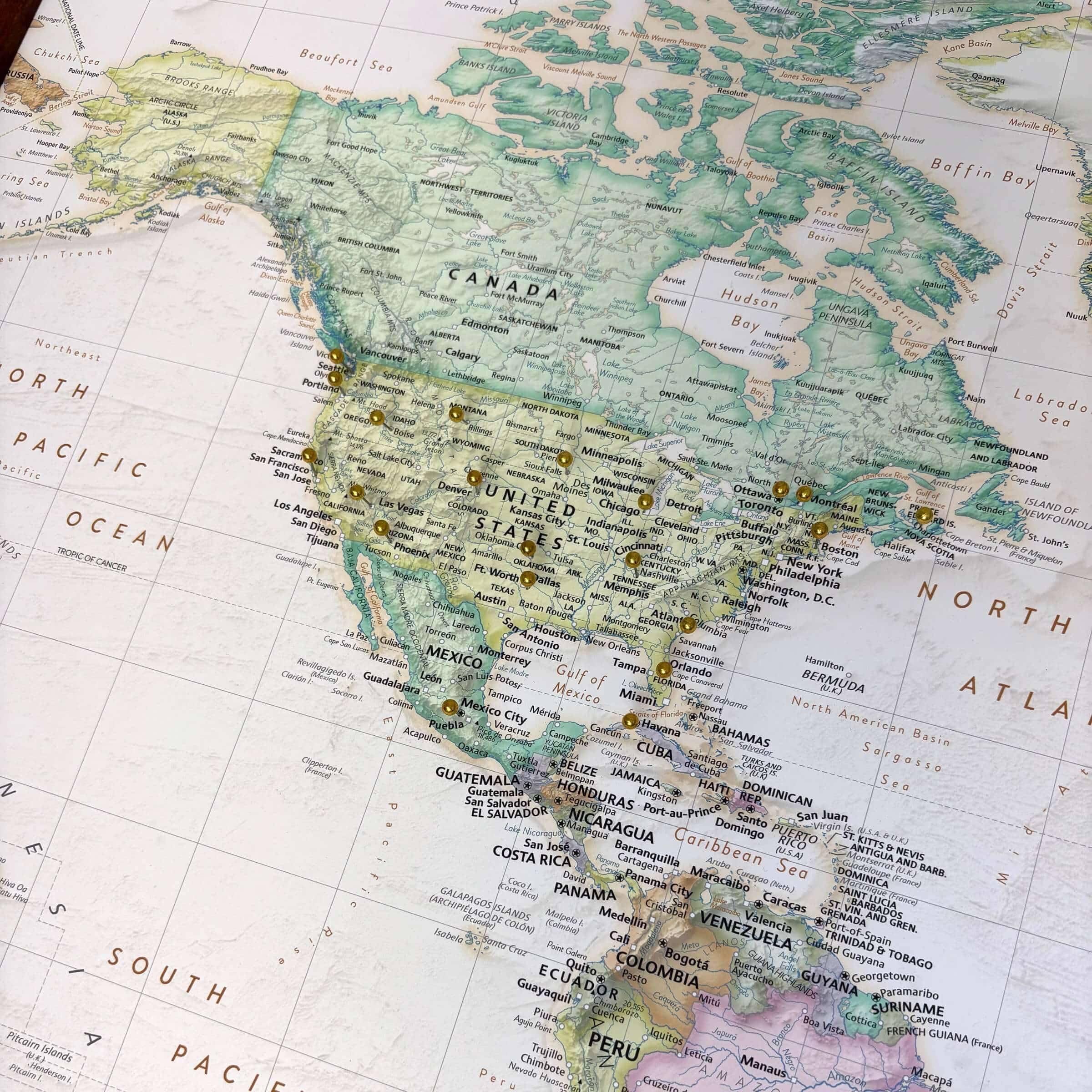 Detailed push pin map of the world. Image is focused on the United States with several decorative pins inserted