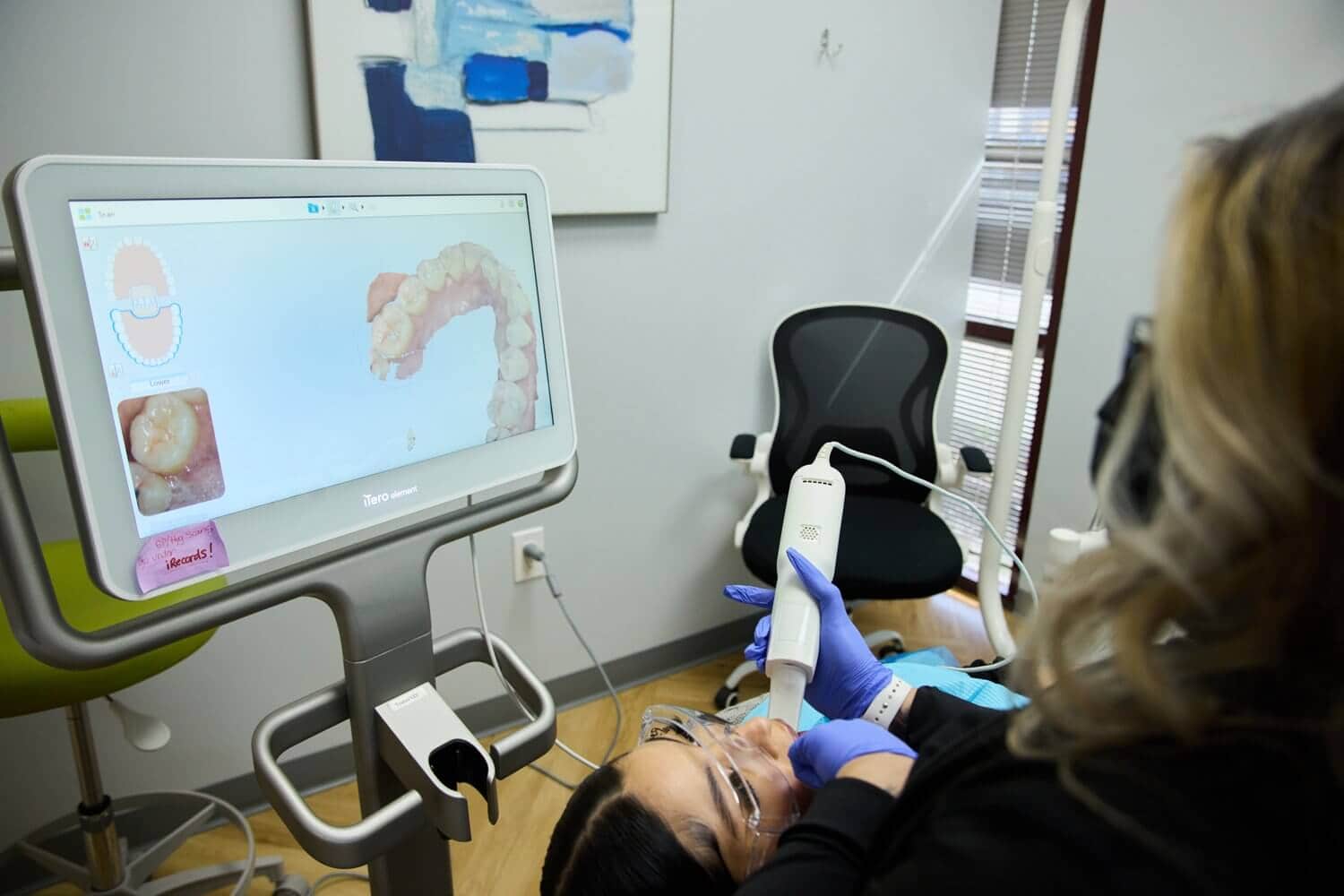 A person lying down and a monitor