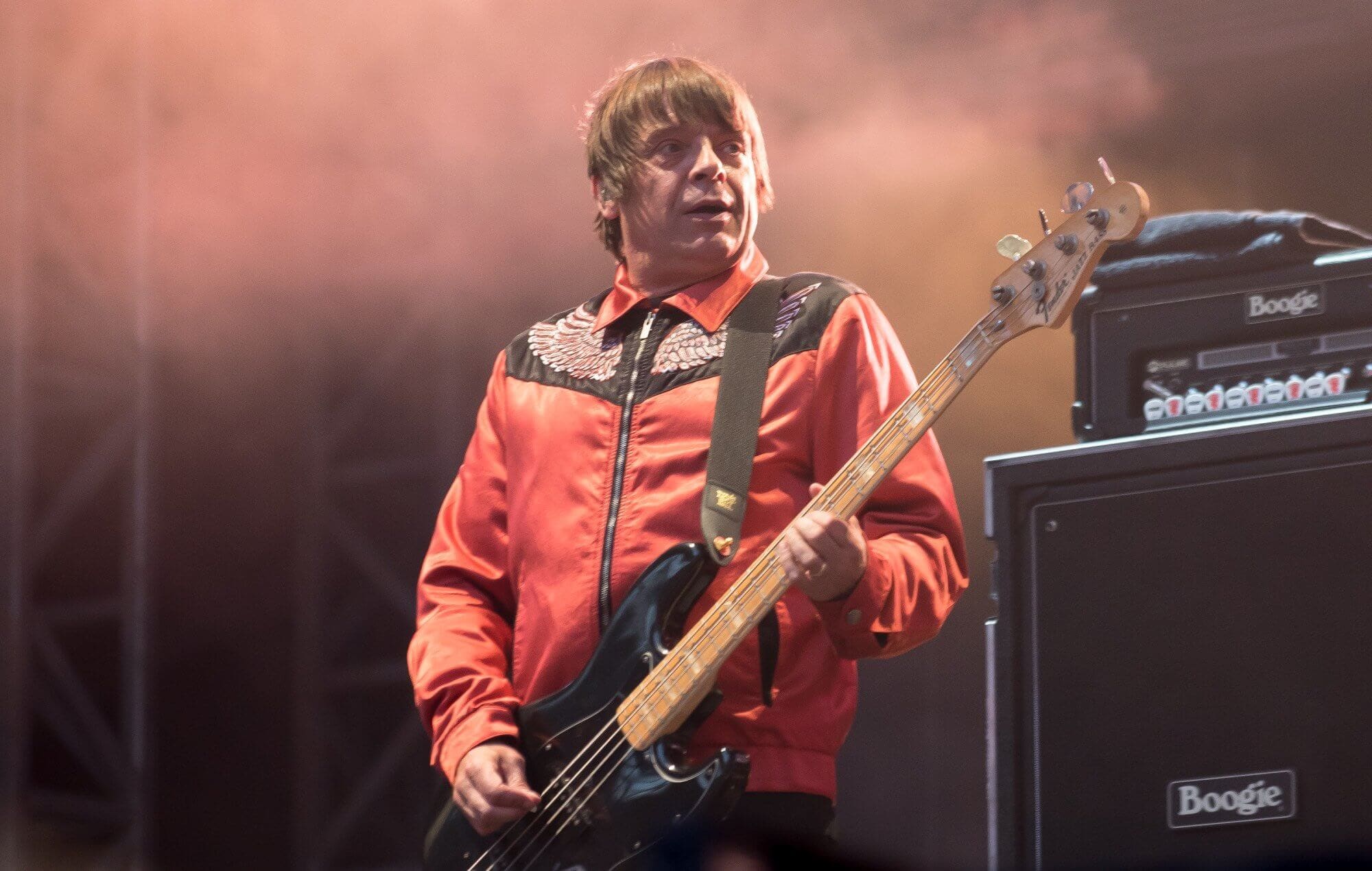 Gary 'Mani' Mounfield performing with The Stone Roses