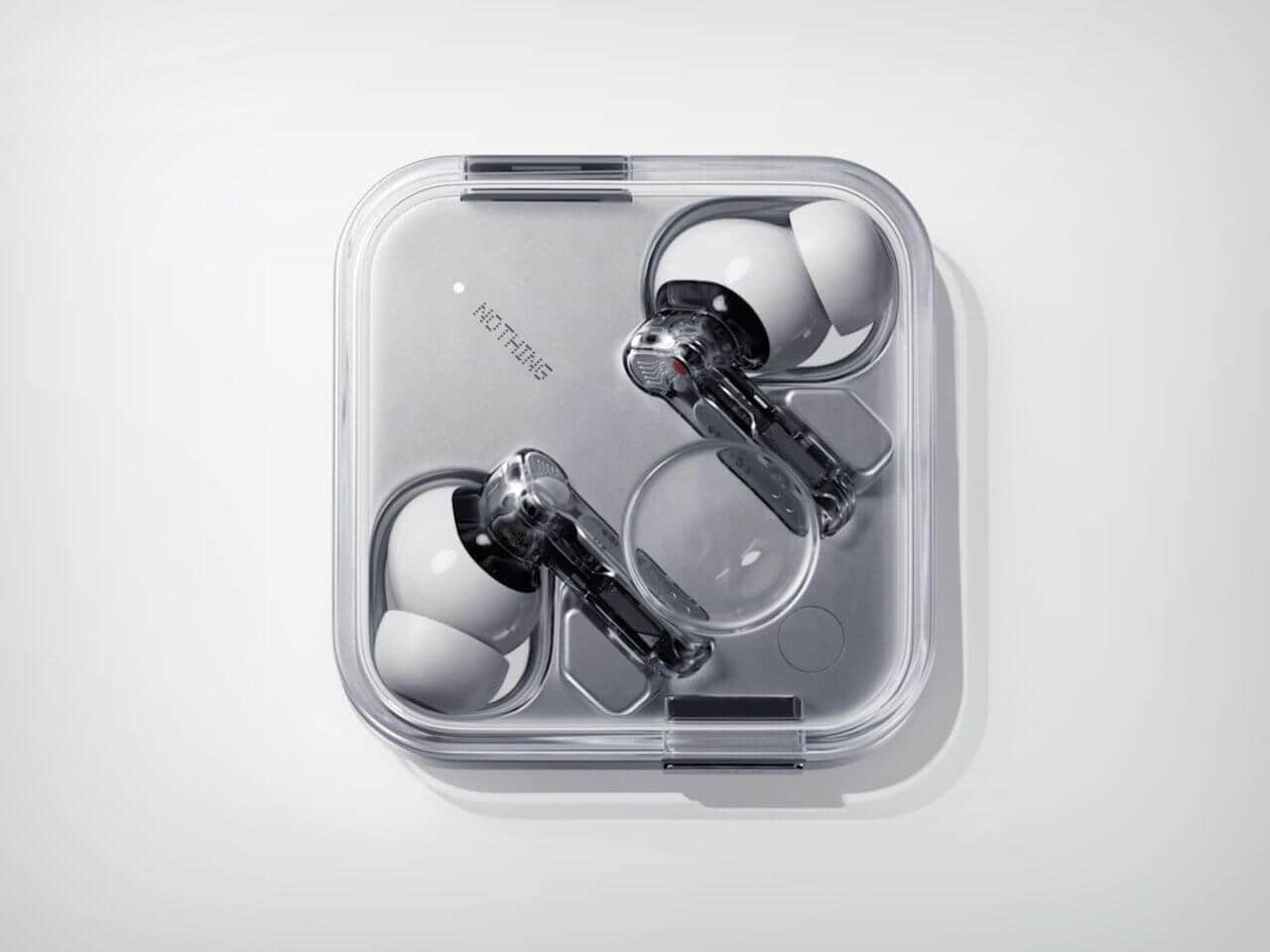 Close-up of Nothing Ear (3) charging case featuring the Super Mic button