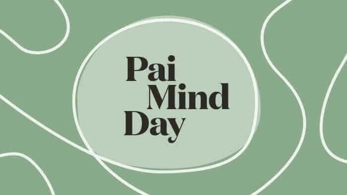 Pai Mind Day logo in dark text on sage green background with flowing white line design