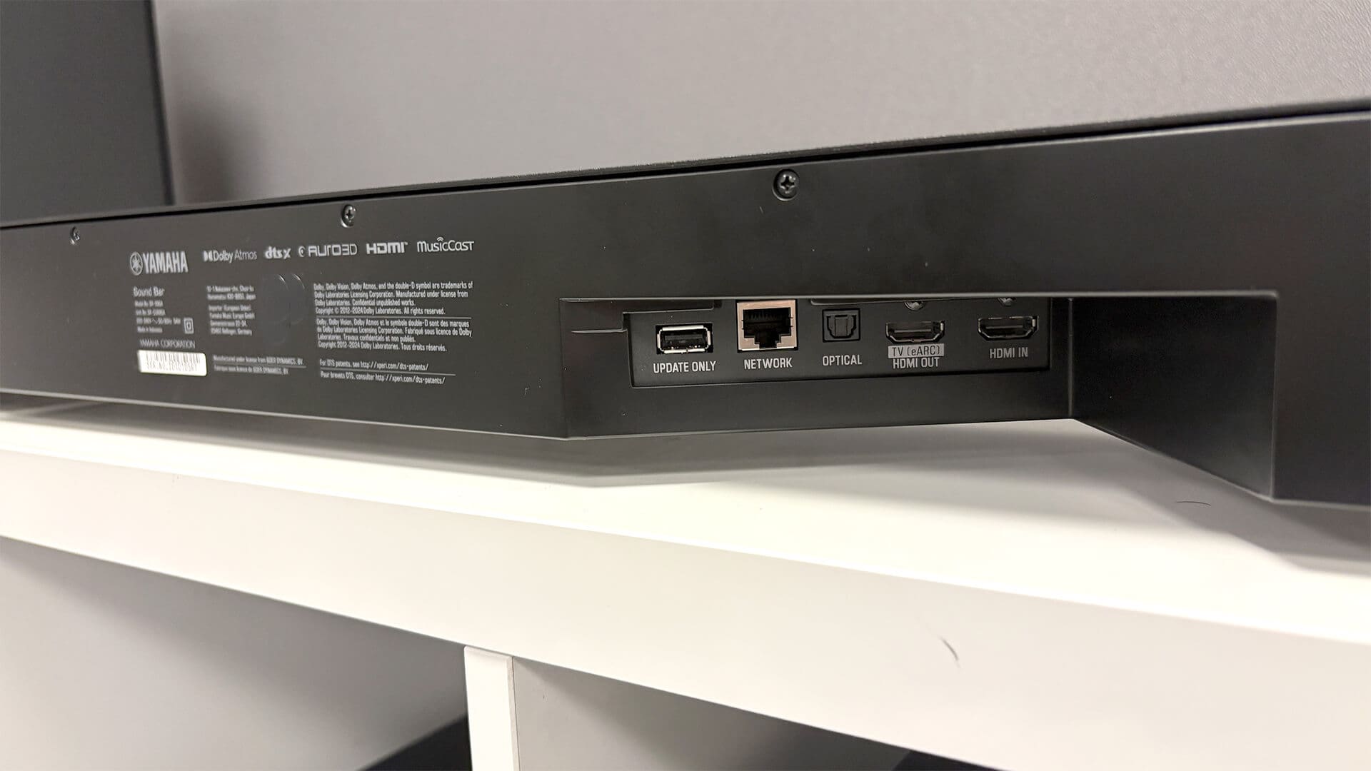 Top controls of WS-X3A surround speaker for pairing and volume.