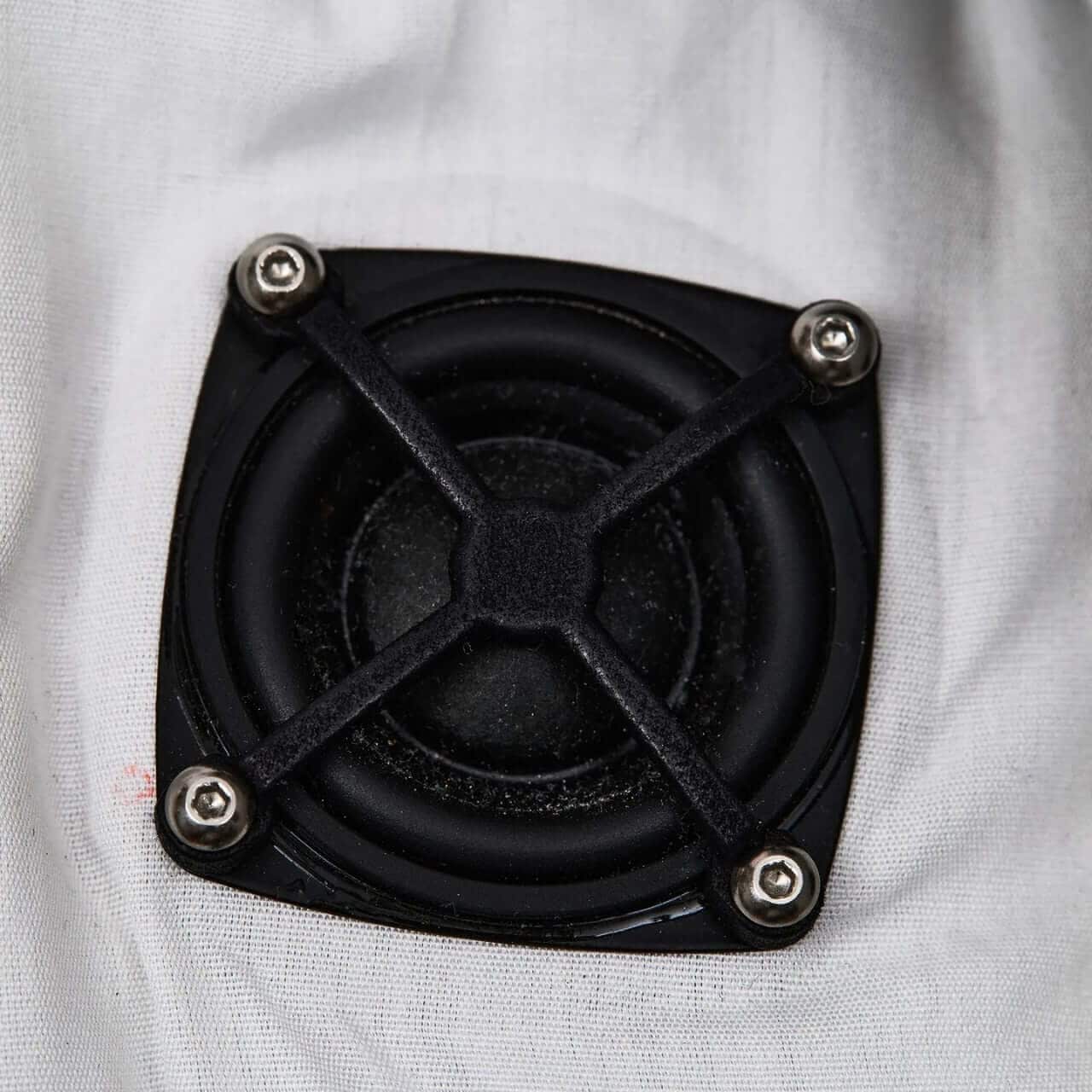 User adjusting dial on jacket