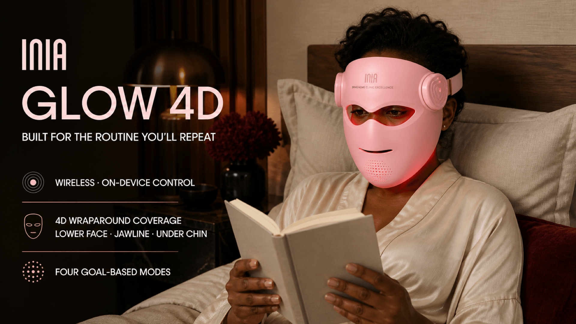 Woman using the wireless INIA GLOW 4D LED mask during an at-home routine