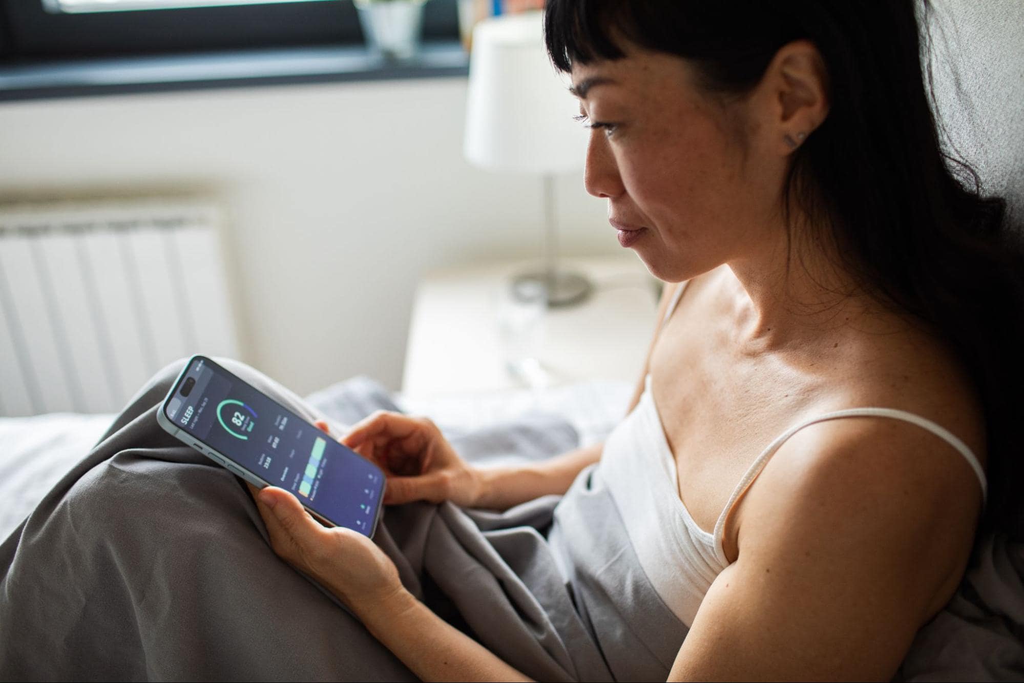 Woman Monitoring Her Sleep Score