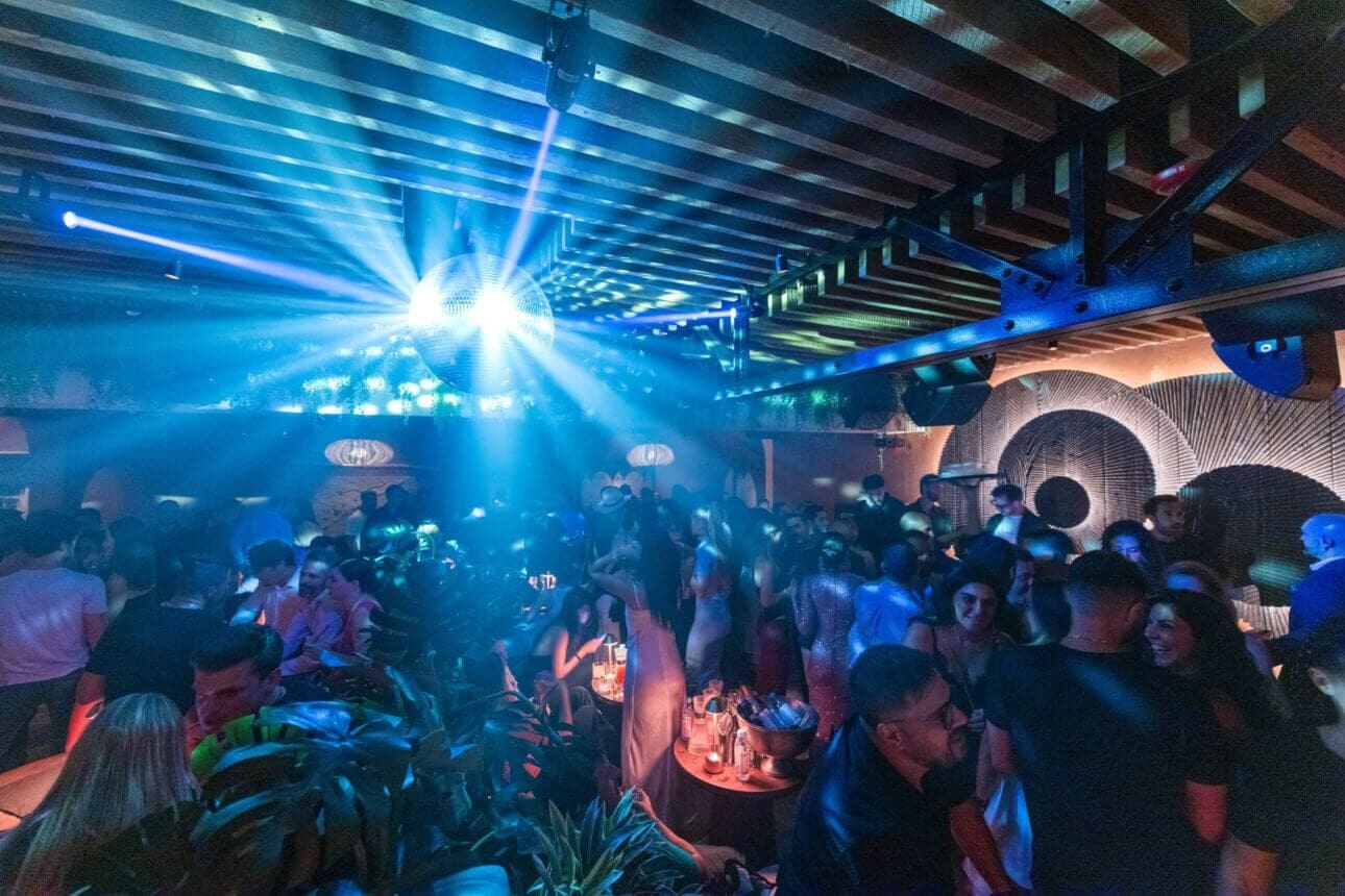 Dixon behind the decks at MILA Lounge, captivating the crowd with deep beats.