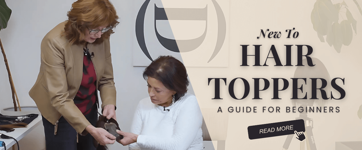 A hair stylist shows a client how to use a hair topper.