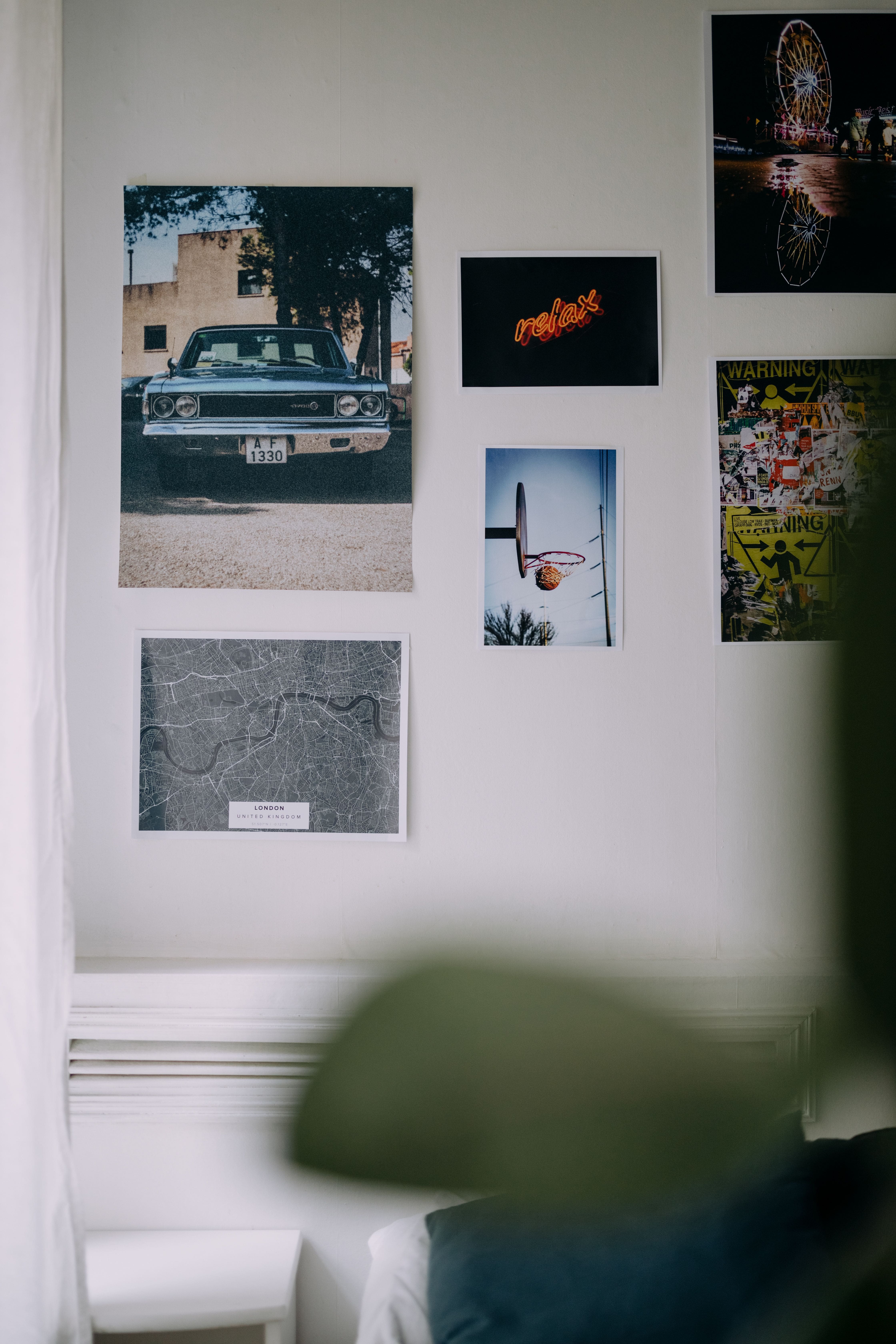 Generic inspiration wall with a coordinated mix of posters and photographs