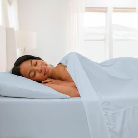 Woman Laying in a Sheex Bed Set