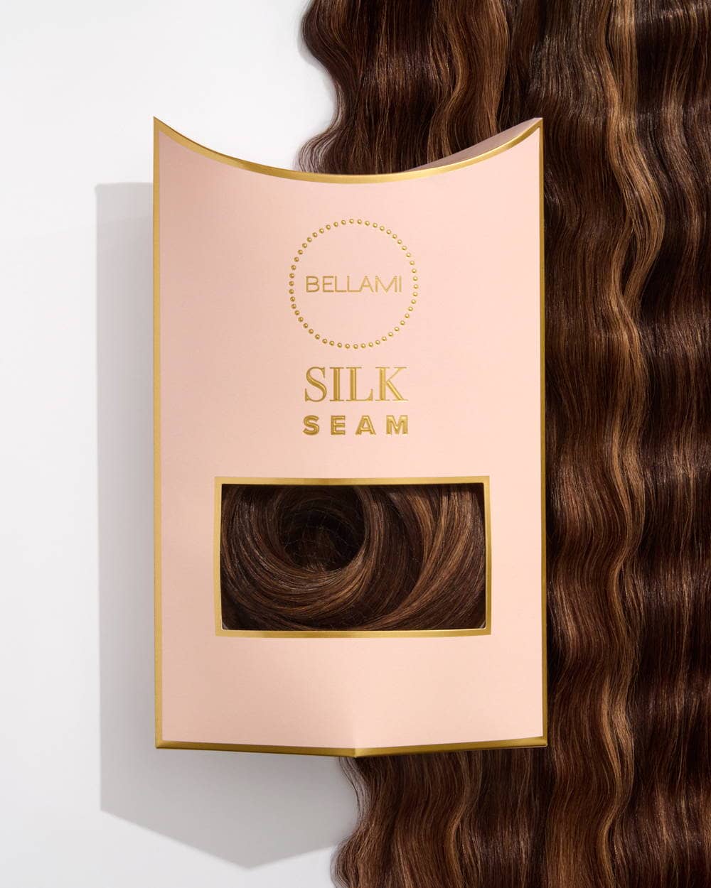 Bellami Silk Seam hair extension packaging featuring a wavy brown hair extension partially displayed.