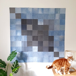 Enhance Your Home with an Eco-Friendly Upcycled Denim Quilt Featuring Sashiko Motifs