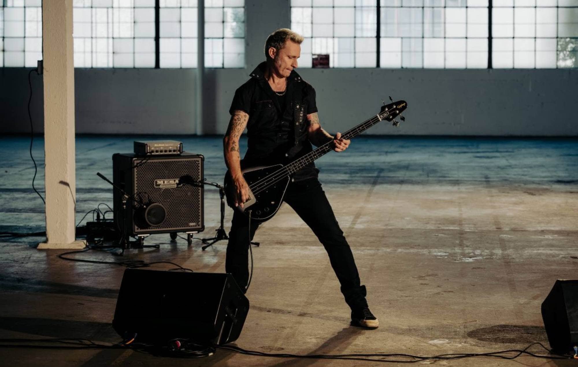Mike Dirnt with the signature Epiphone Grabber G-3 bass guitar