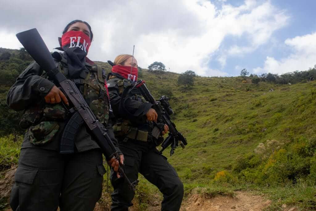 ELN guerrillas stand guard in Colombia near Venezuelan border