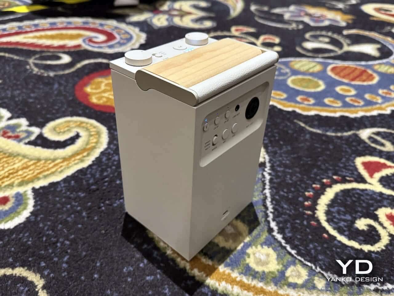 Side view highlighting the speaker's driver layout and battery info