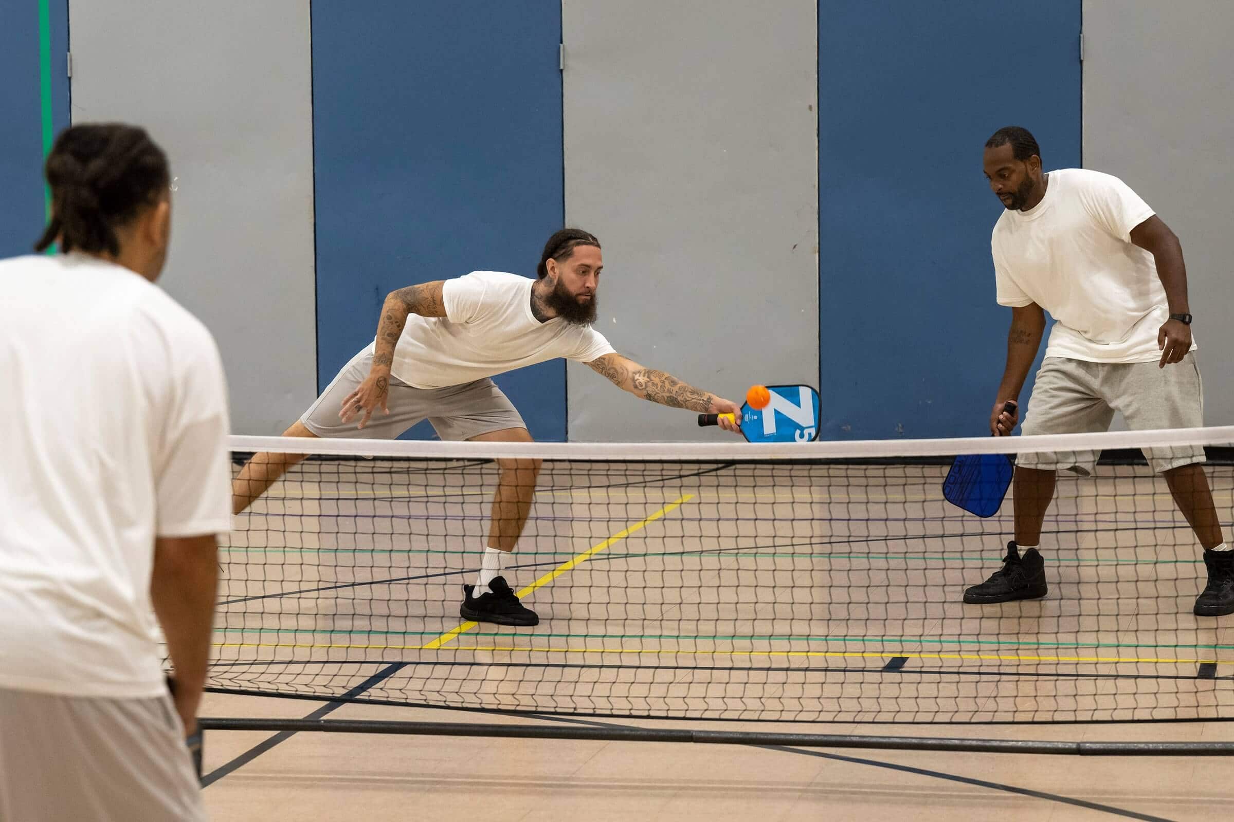 Pickleball in prisons — doubles partners building teamwork and communication on the court