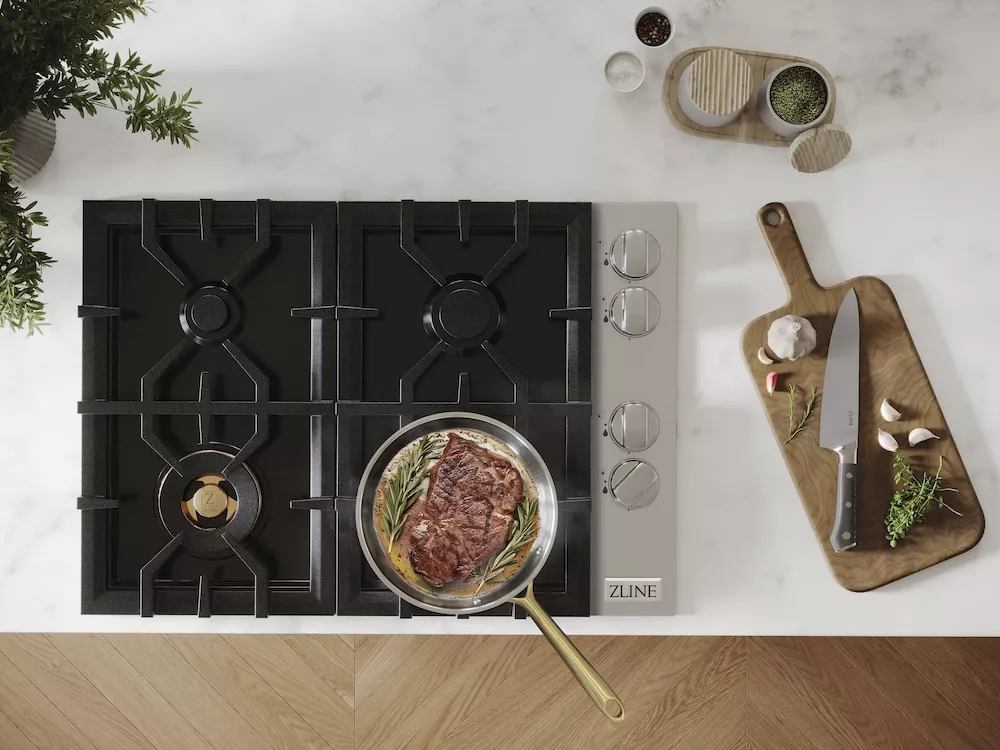 Cooktops vs. Rangetops: Gas cooktop with food in frying pan from above.