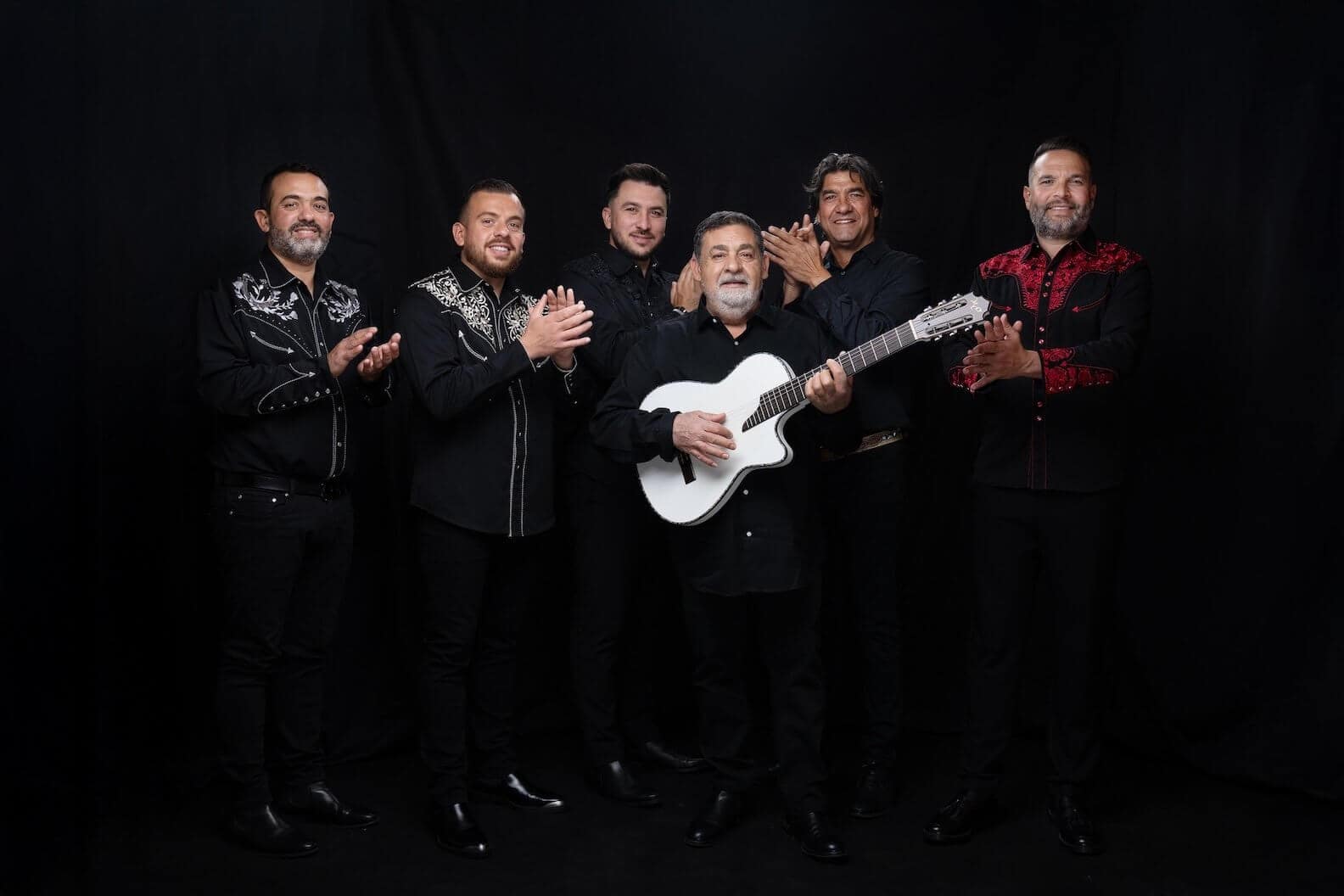 Gipsy Kings feat. Tonino Baliardo in a powerful group portrait.