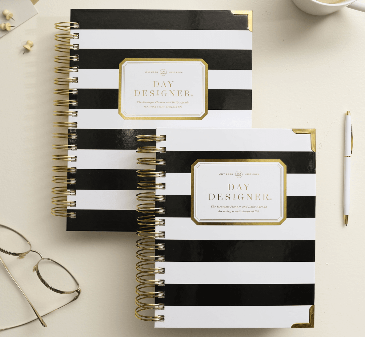 which planner size is best for you, stacked blush day designer planners with gold binding,