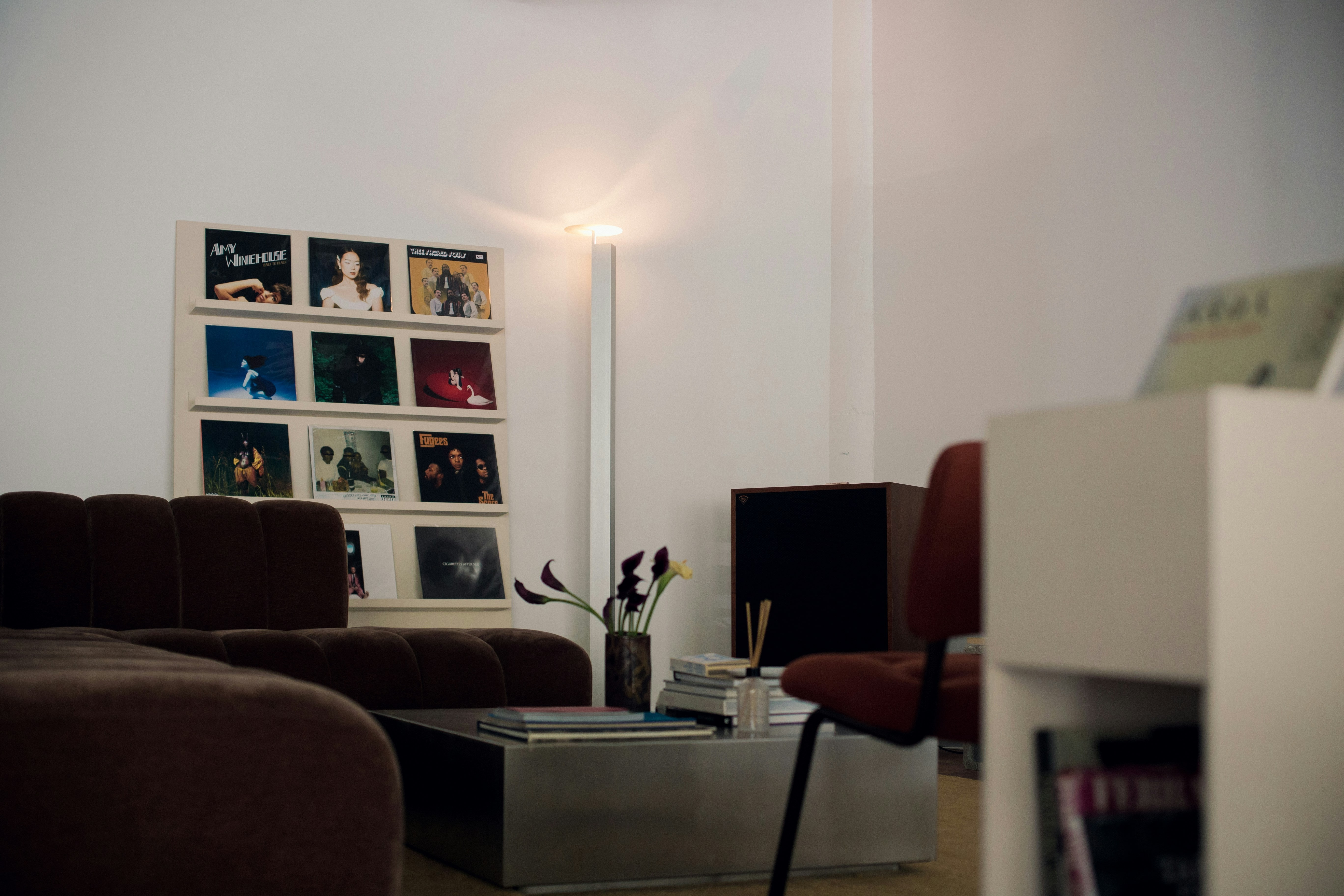 Living room with vinyl records displayed on wall shelves as music-room inspiration