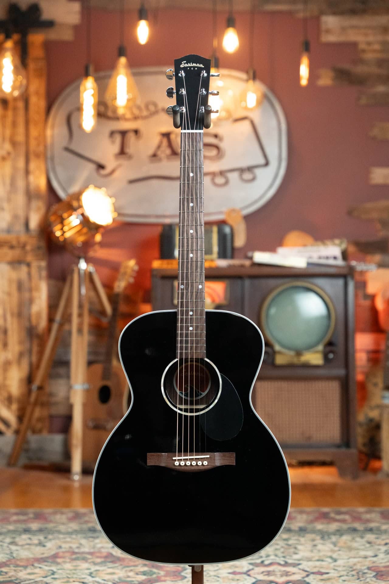 Eastman PCH2-OM-BK, our top-ranked acoustic guitar under $500, with a gloss black thermo-cured Sitka top