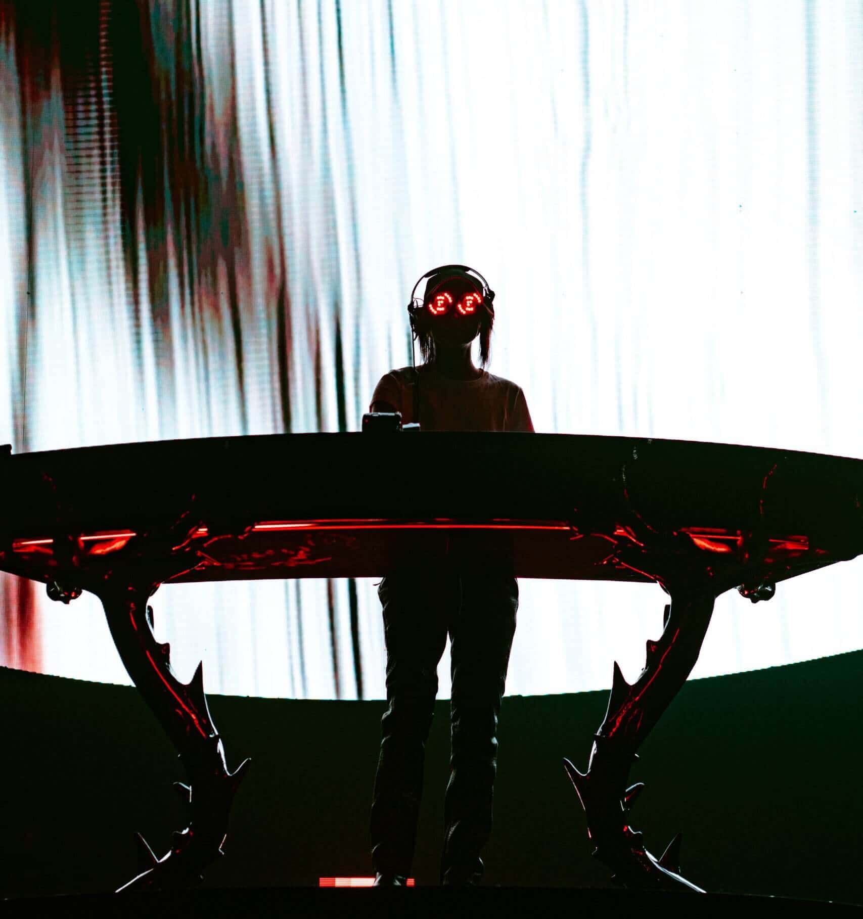 REZZ commanding the stage with her intense presence.