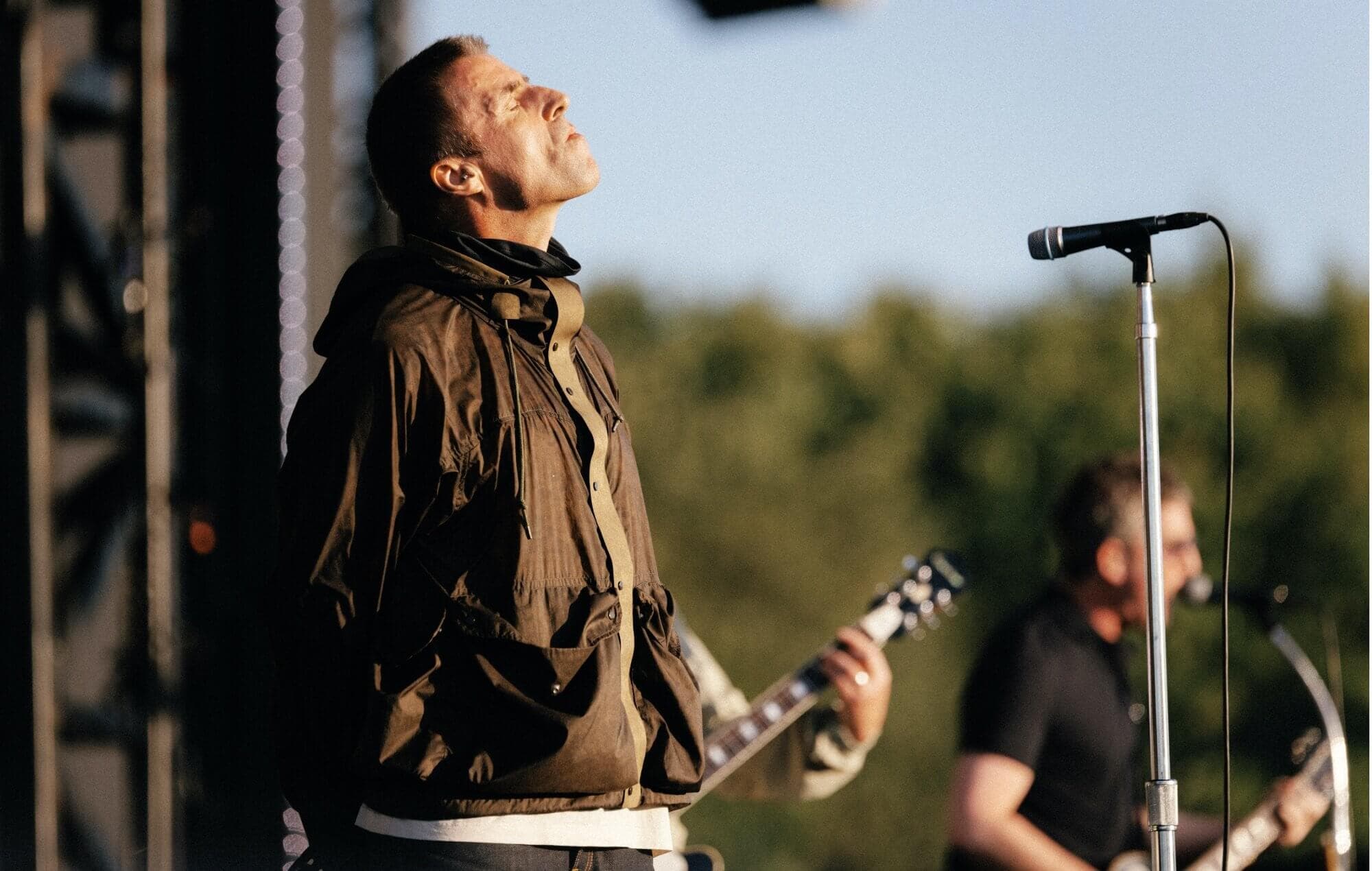 Liam Gallagher performing live on stage with Oasis at Manchester's Heaton Park