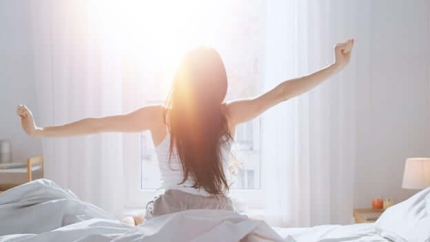 Woman Waking Up Happy After a Good Night Sleep