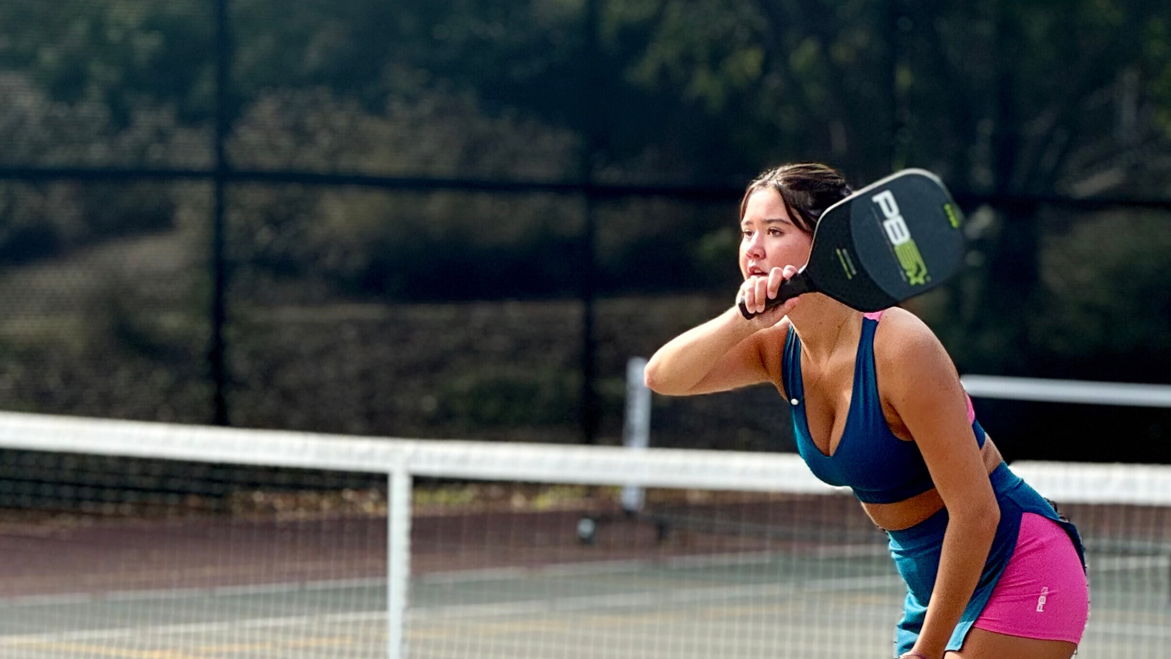 Woman focused on playing pickleball