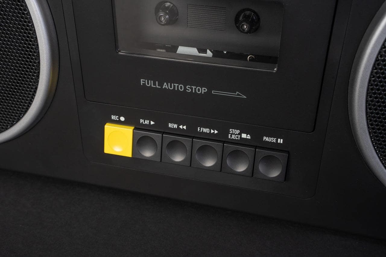 Four-speaker layout with chrome-trimmed cassette compartment