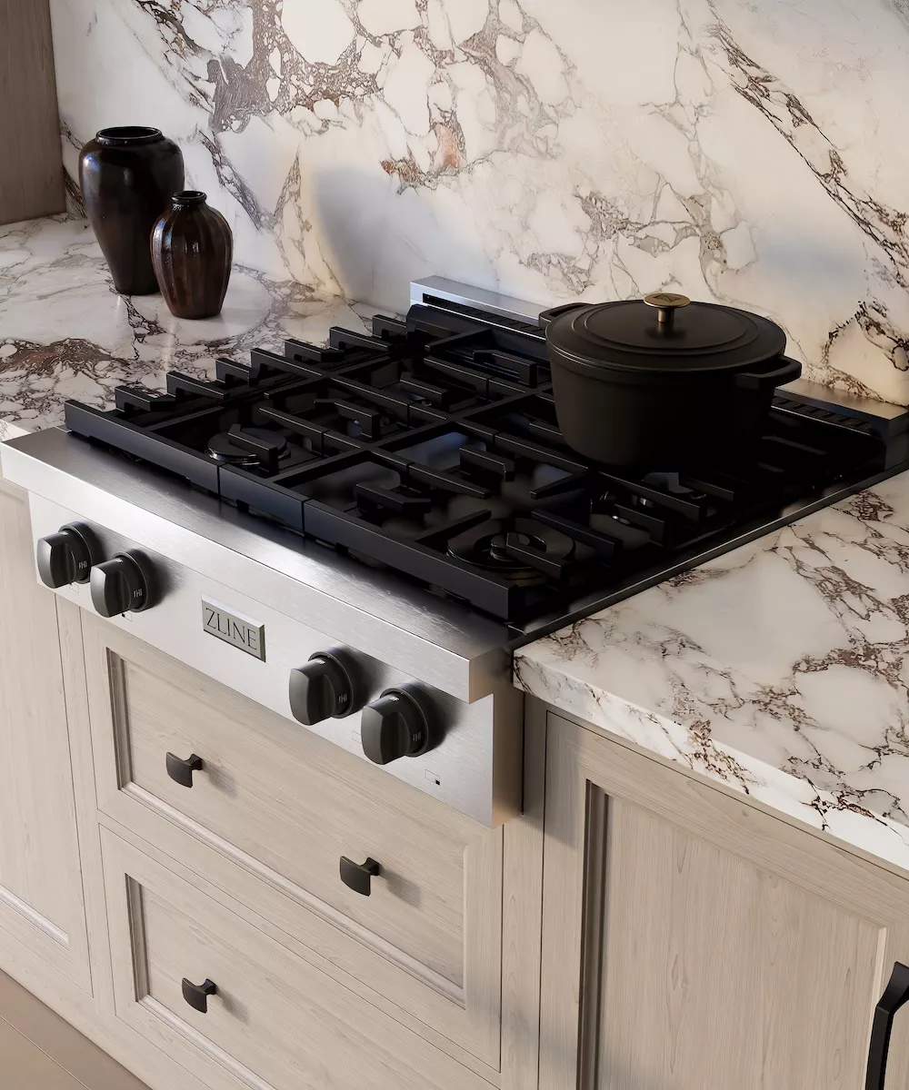 Cooktops vs. Rangetops: Compact rangetop with a black pot on cooking surface.
