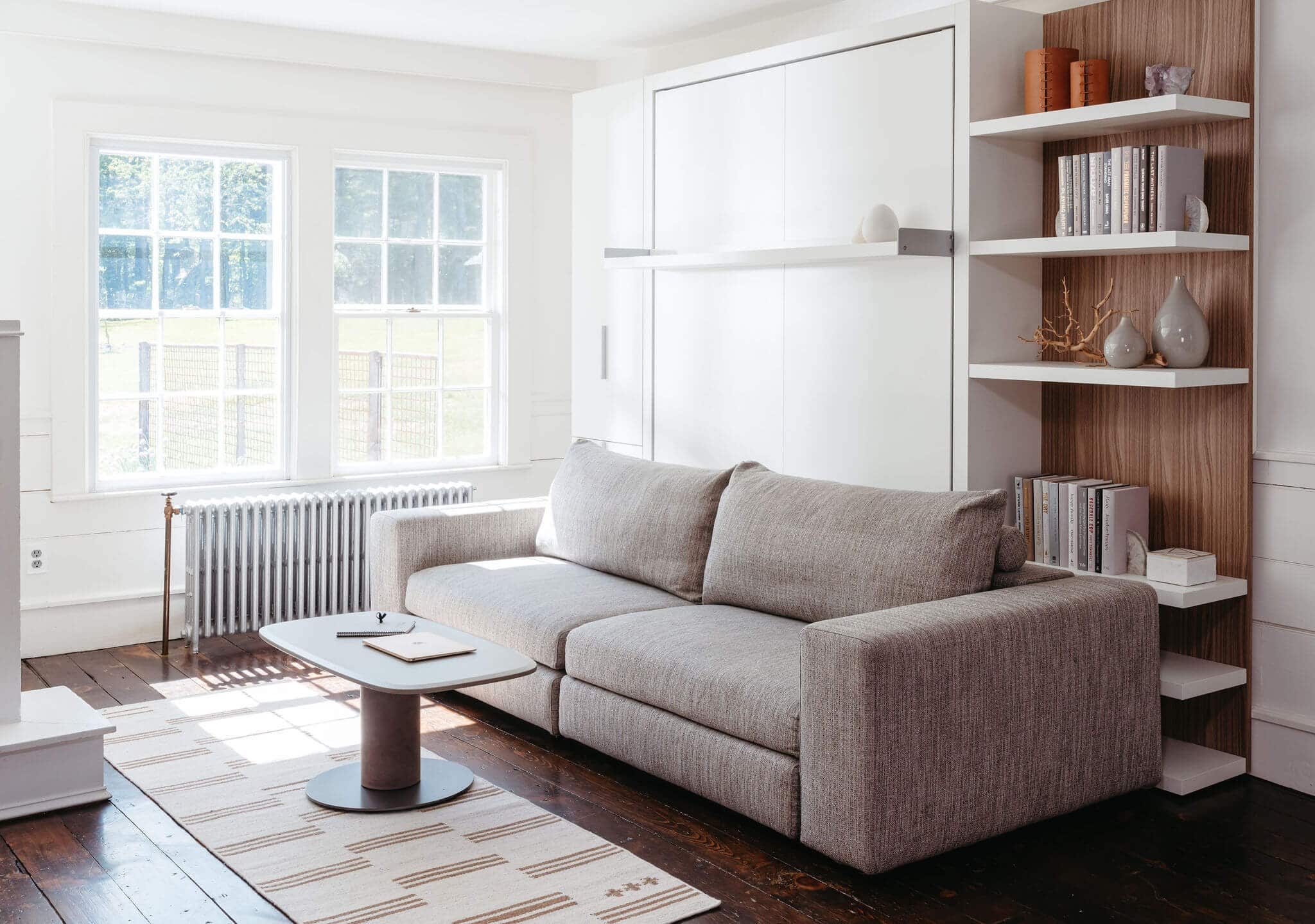 Tango Sofa Wall bed from Resource Furniture, with custom shelving and cabinet for storage