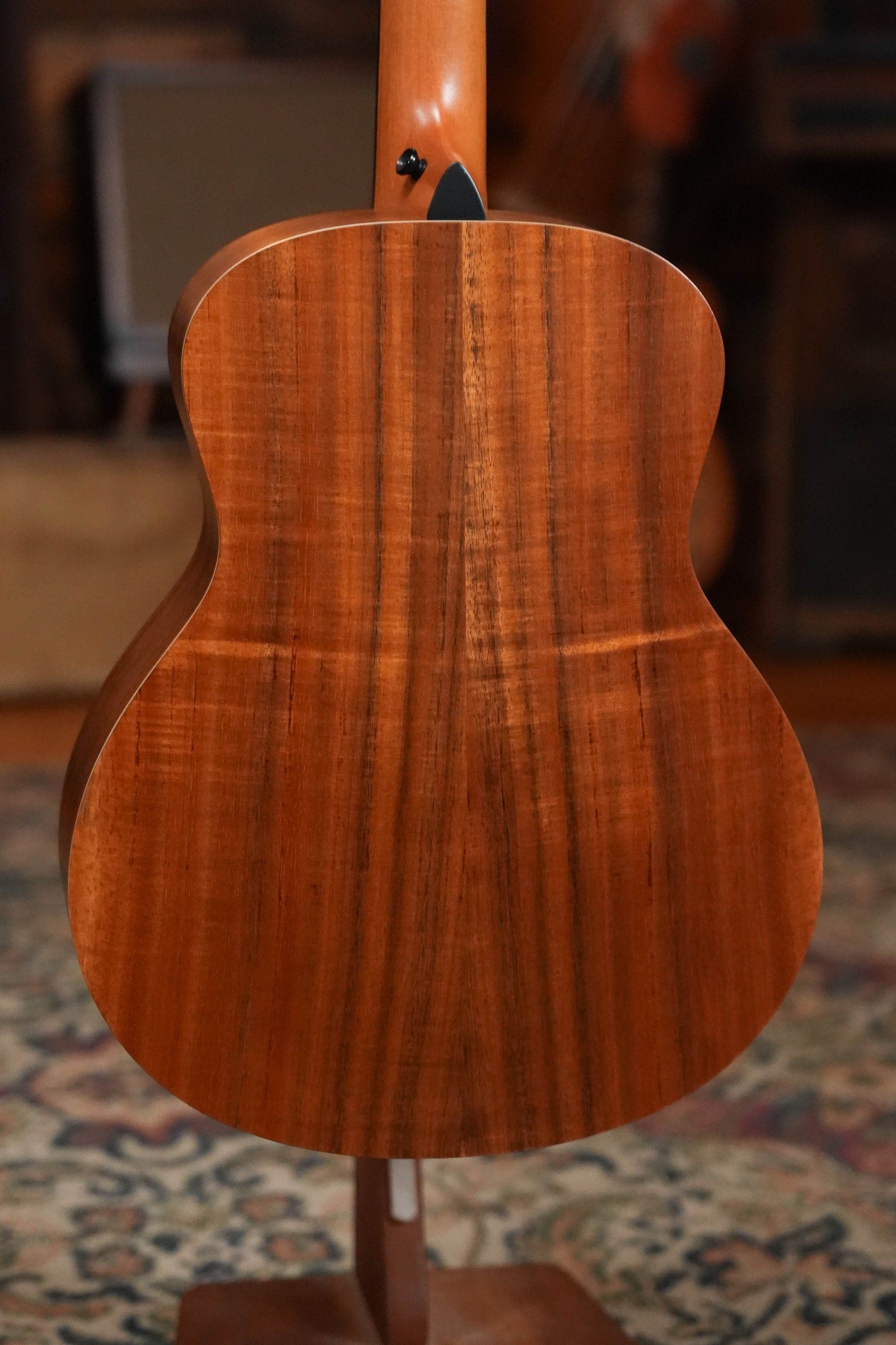 Back of a Taylor GS Mini-e Koa showing the figured layered koa