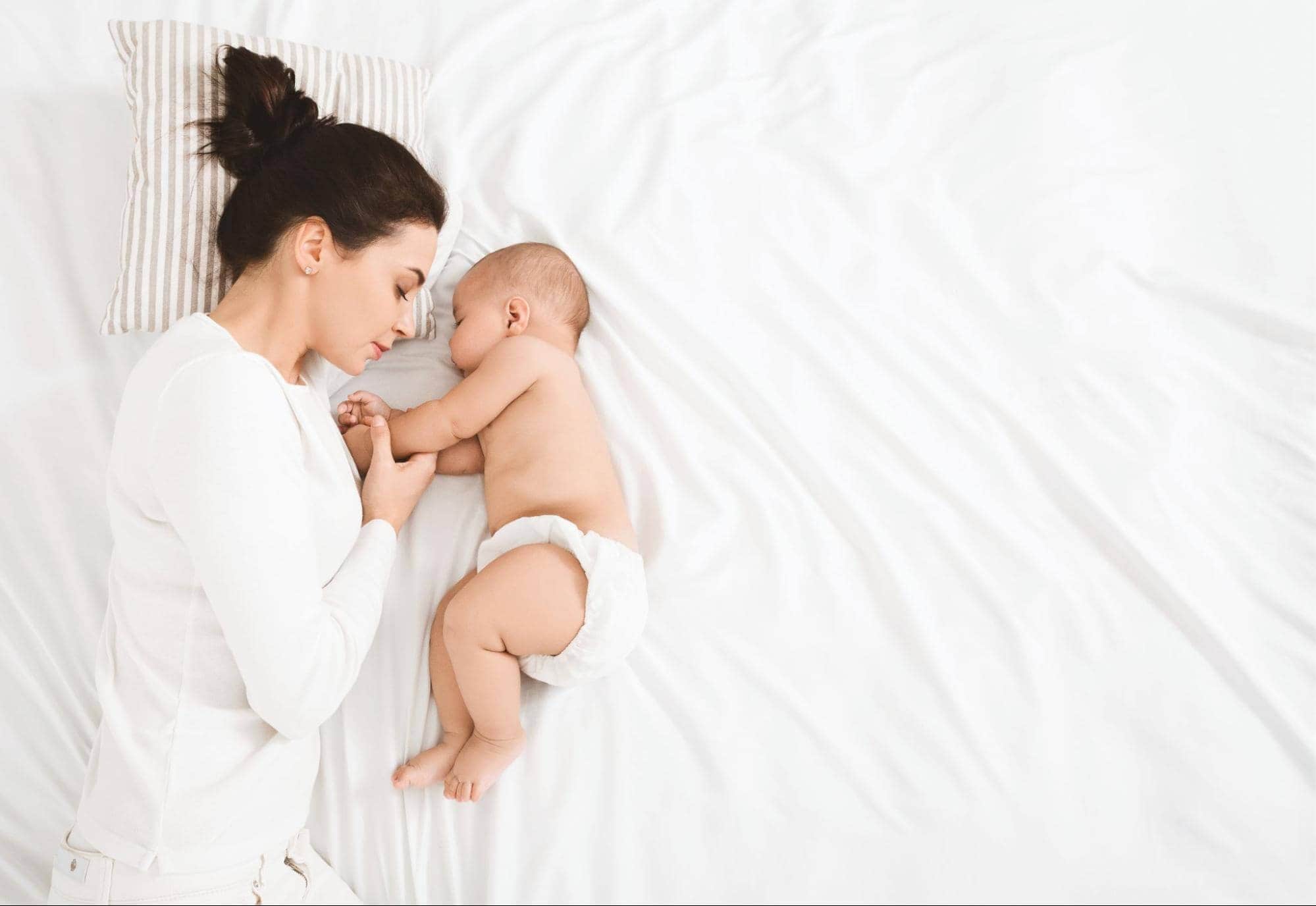 Mom and Baby Laying in SHEEX Bedding with Good Sleep Hygiene