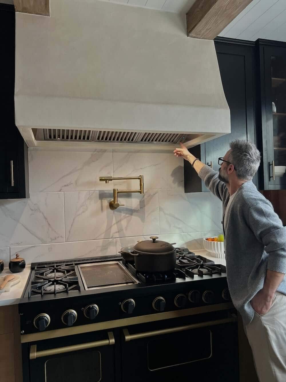 Man using a custom range hood