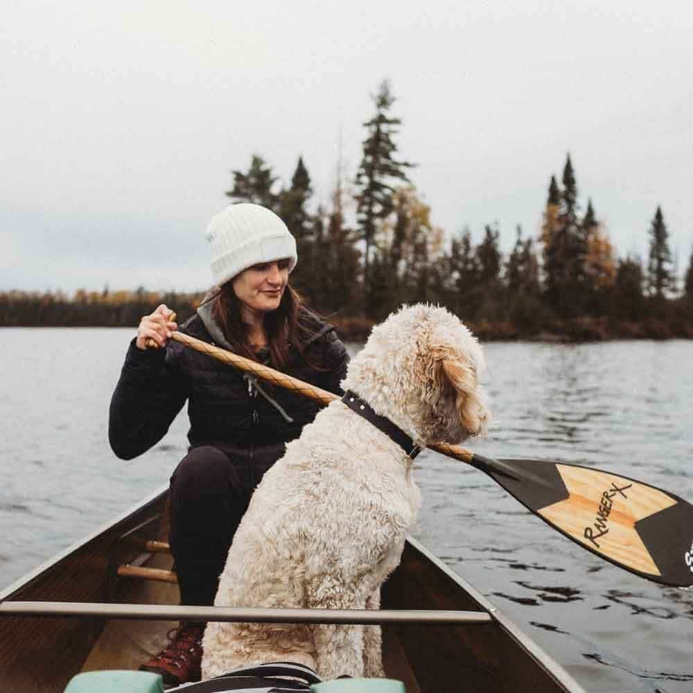 boating with a dog in a canoe on a lake