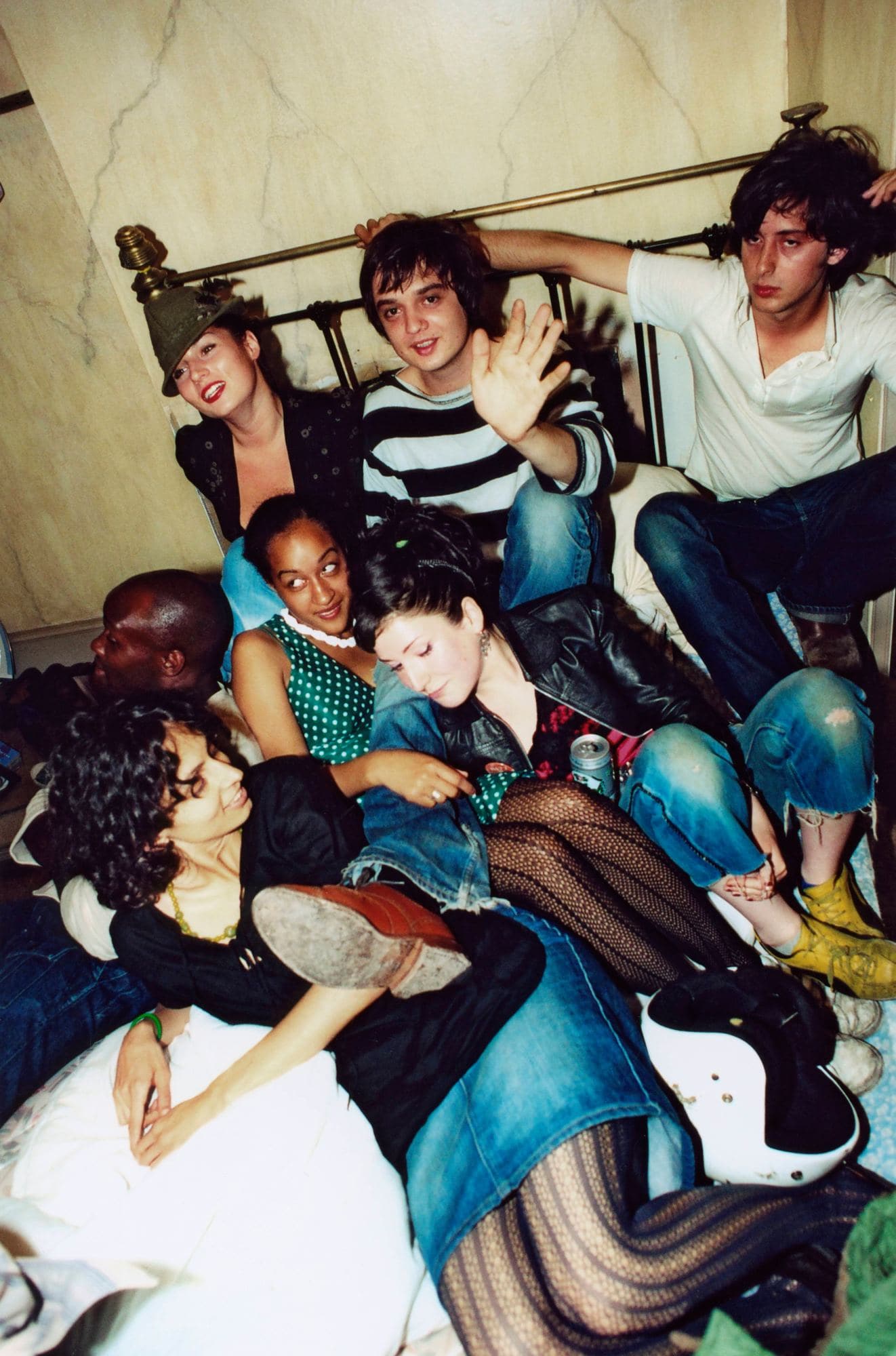 Pete Doherty, Carl Barat and Gary Powell from The Libertines with friends at the Albion Rooms in Bethnal Green, London, 2002. Credit: Patrick Ford/Redferns